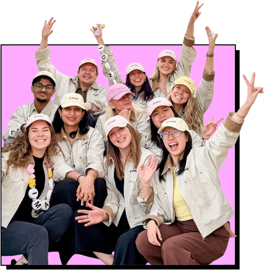 A group of people in imagi caps and jackets cheering together